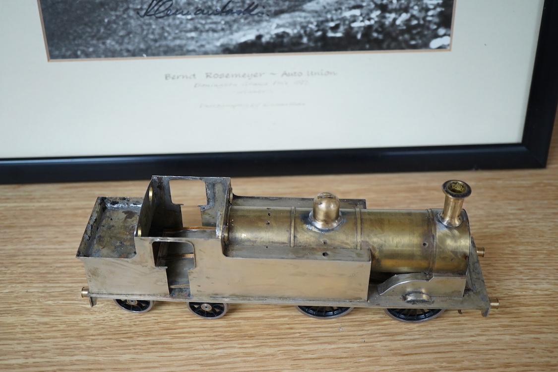 Eleven 0 gauge model railway items including; a bogie stake wagon, two mineral wagons, a North British coal wagon and two further open wagons, a partly constructed brake van, together with a Lima LMS 4F locomotive, two L